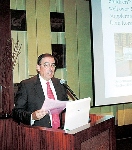 Rev. Tim Peters delivers a speech at an event sponsored by the British Chamber of Commerce