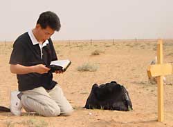 Chul Min's father at his son's grave.