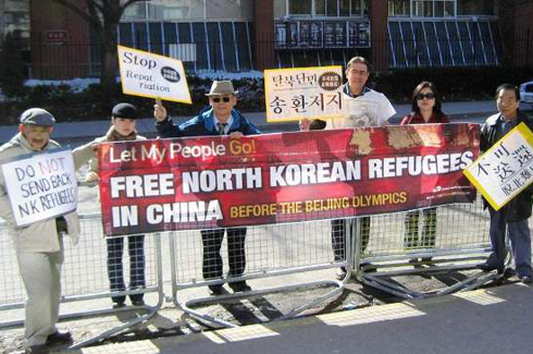 Rev. Tim Peters leads a demonstration in Toronto, Canada